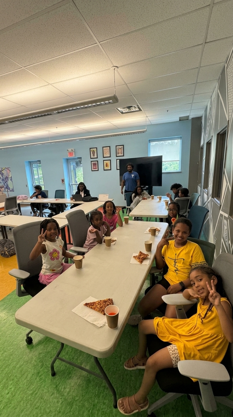 Newcomer families and volunteers talking together in a community hall
